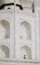 man standing on mosque during daytime