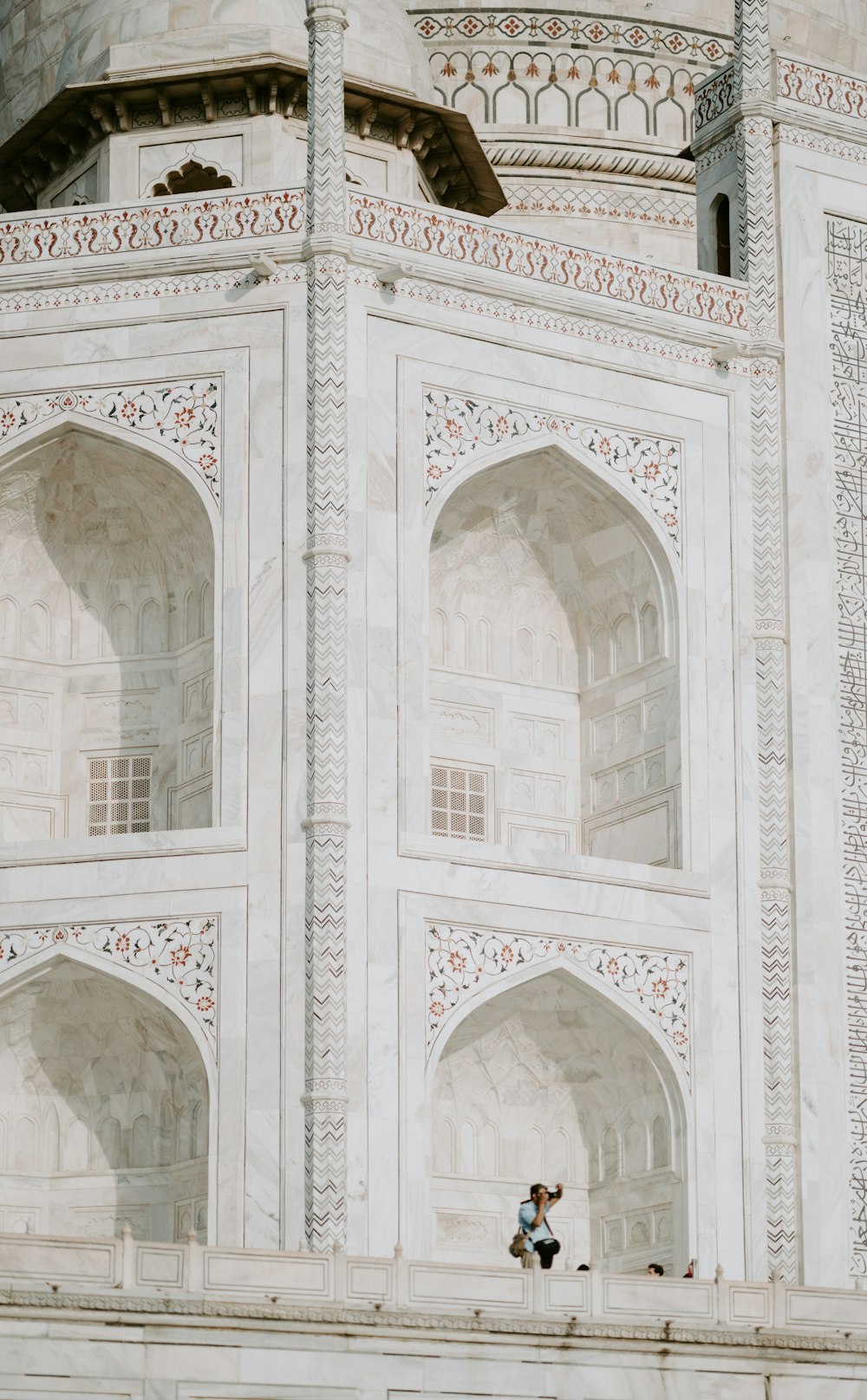 man standing on mosque during daytime