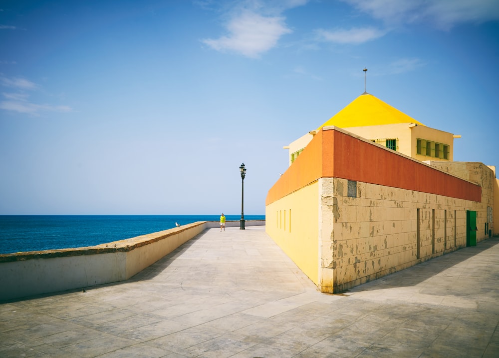 white and orange concrete structure near seaside