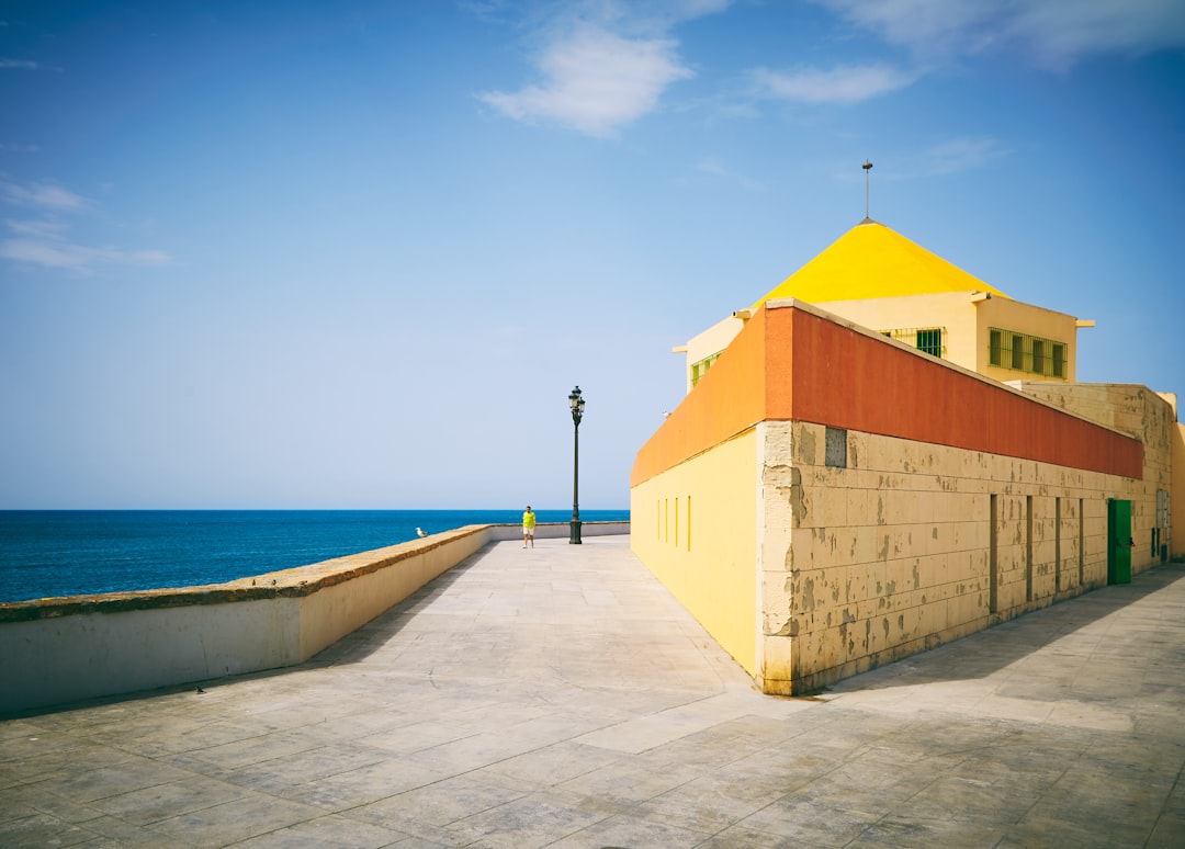 white and orange concrete structure near seaside