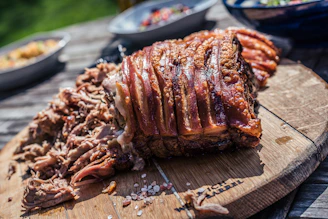 grilled meat on brown chopping board