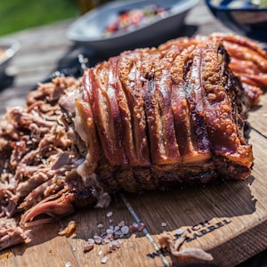 grilled meat on brown chopping board