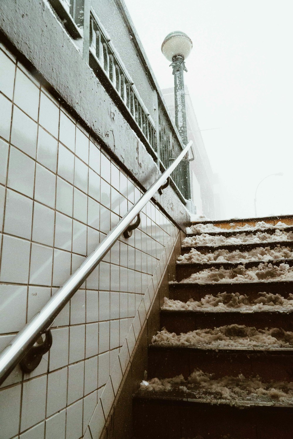 wooden stairs with metal handle