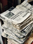 bundle of newspaper on table
