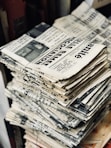 bundle of newspaper on table