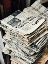 bundle of newspaper on table