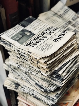 bundle of newspaper on table