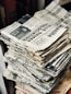 bundle of newspaper on table
