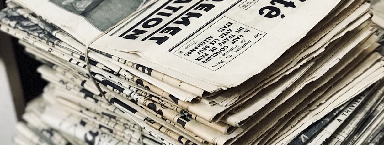 bundle of newspaper on table