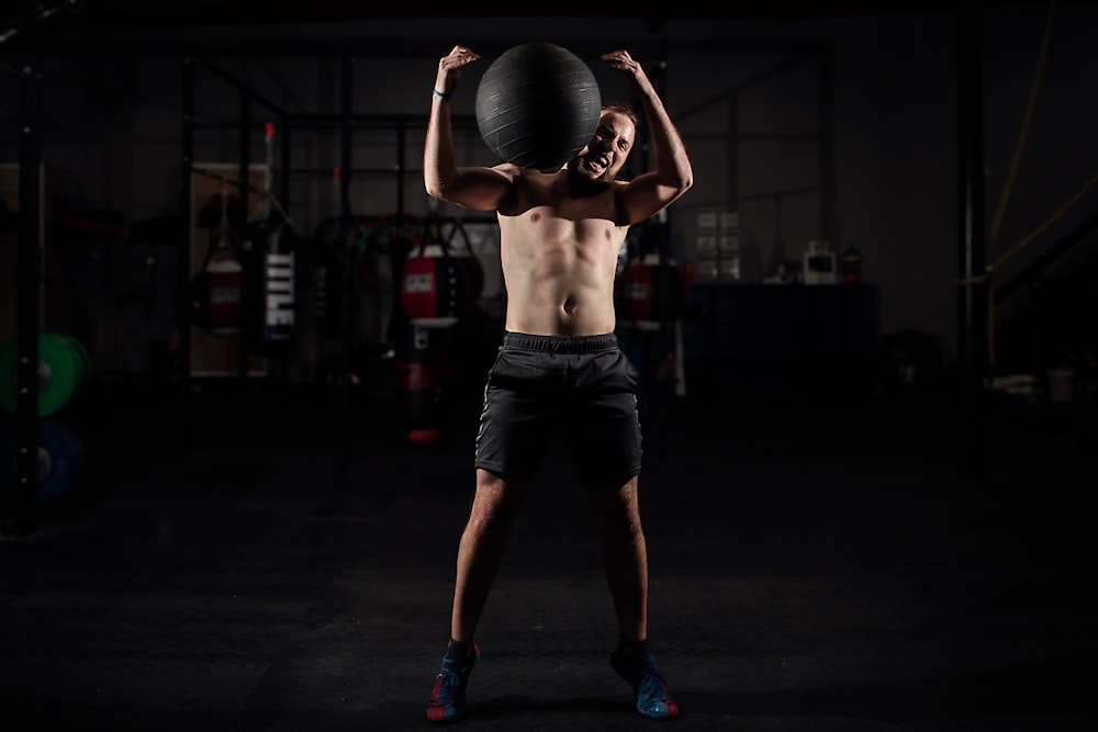 man carrying stability ball