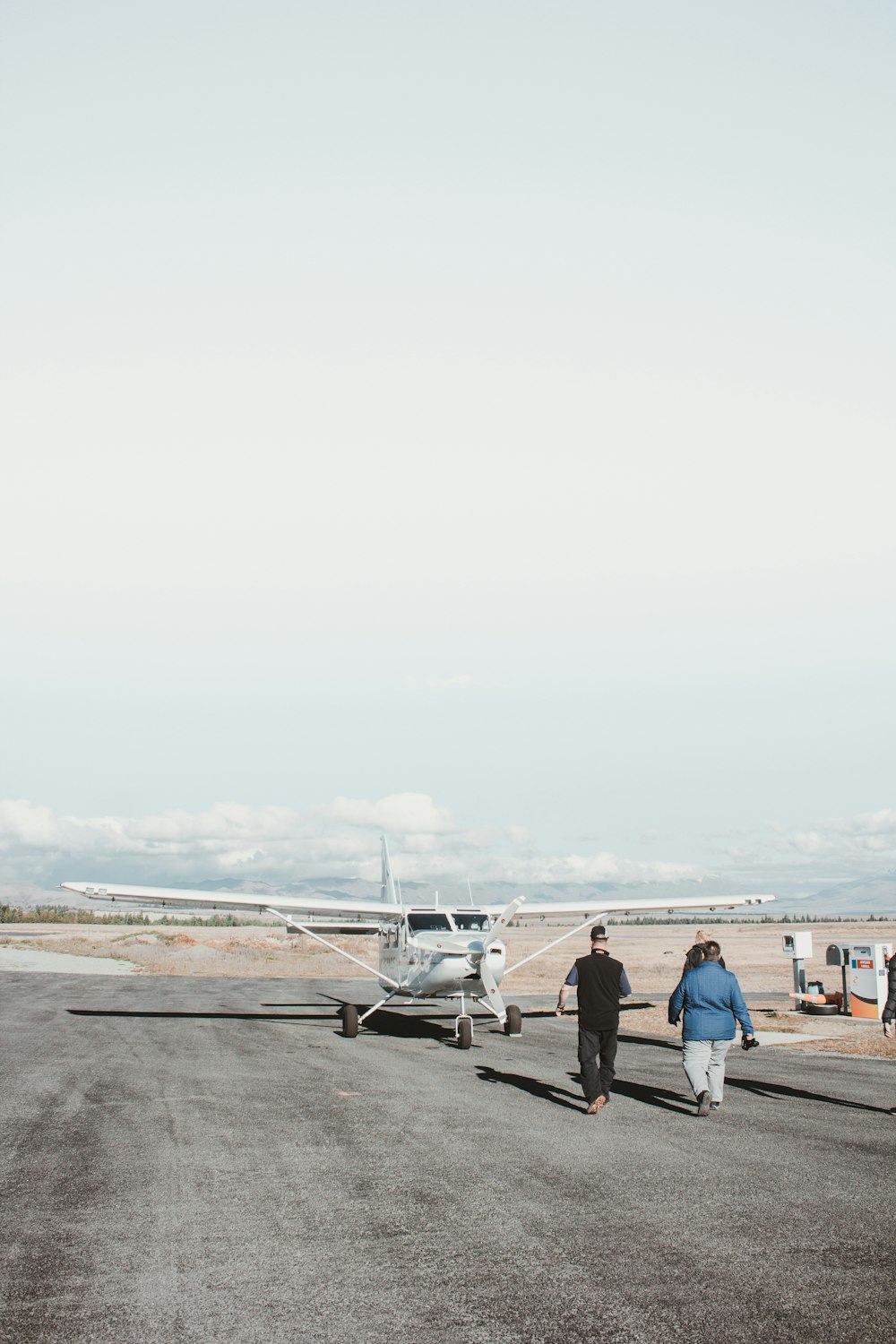 people walking near biplane