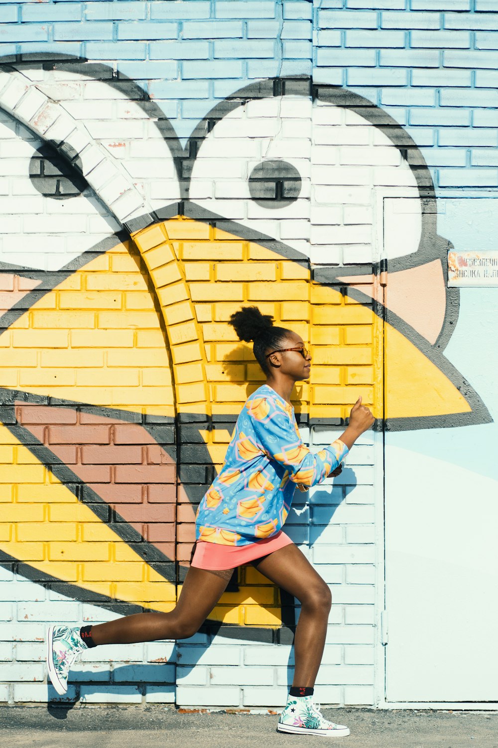 woman running on painted wall