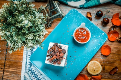 square chocolate cake on blue serving plate delicious google meet background