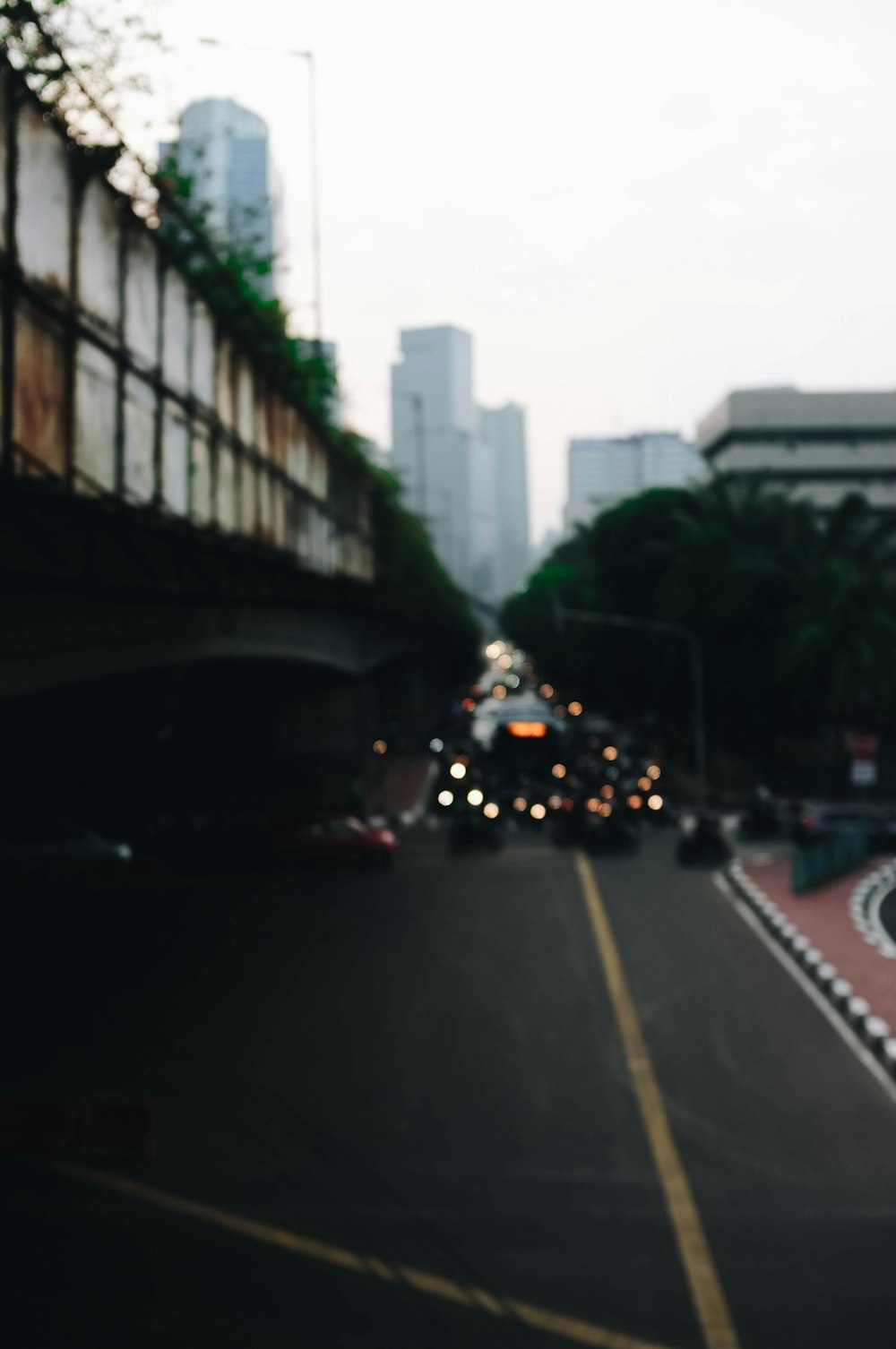 aerial view photography of cars near trees and bridge