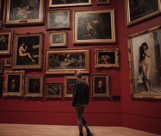 woman standing in front of paintings