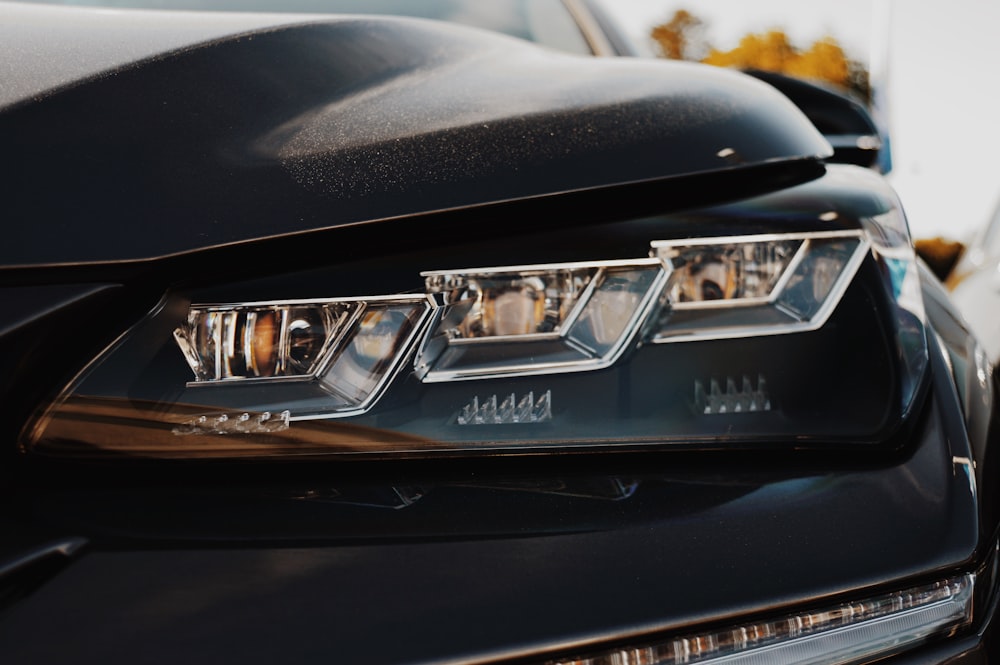 selective focus photograph of vehicle headlight