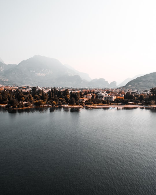 aerial view photography of city covered with fogs in Lake Garda Italy