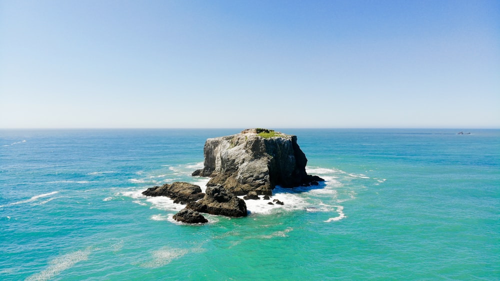 island on ocean during daytime