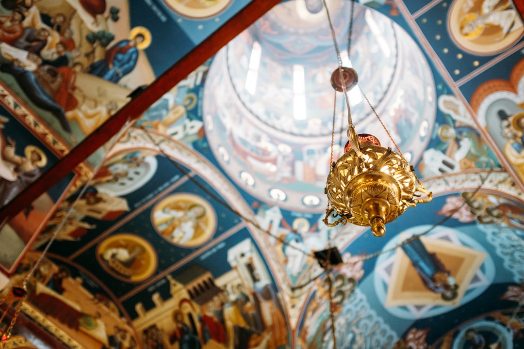 selective focus photograph of gold pendant lamp