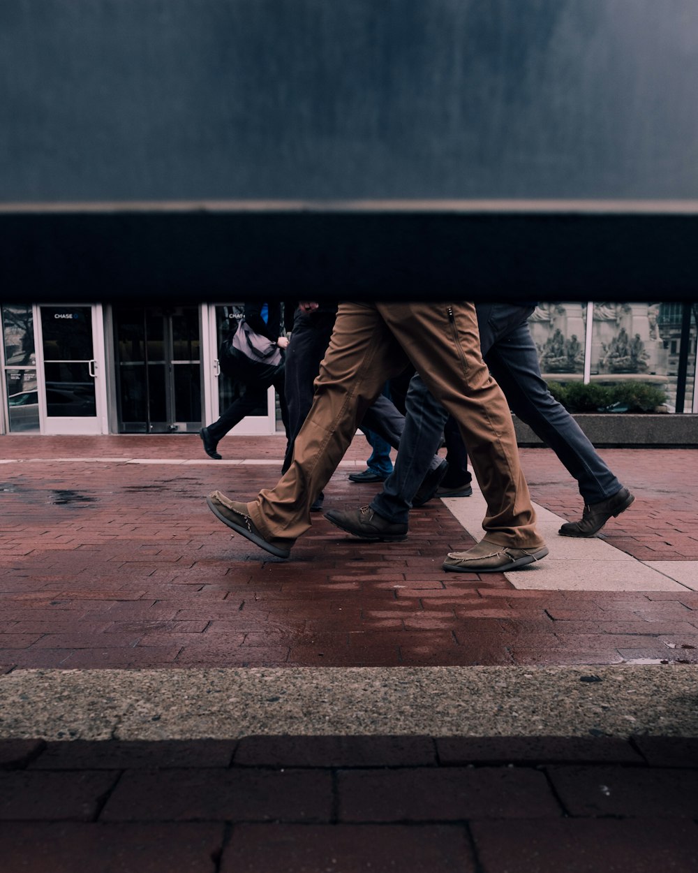 people walking at the concrete brick