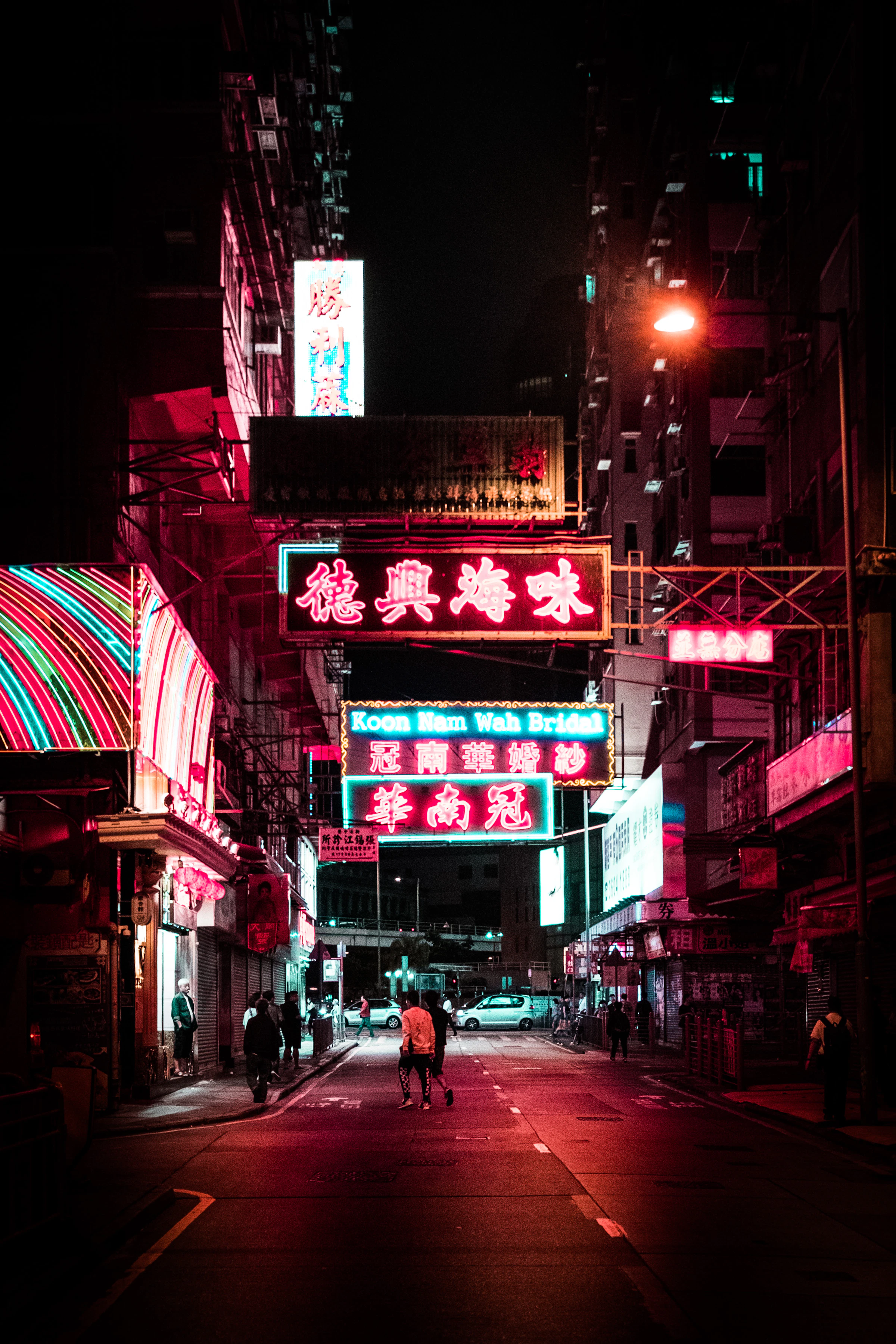 A real street scene in Hong Kong illuminated by neon at night
