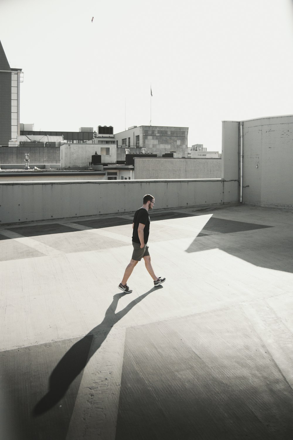 man walking on building roof top