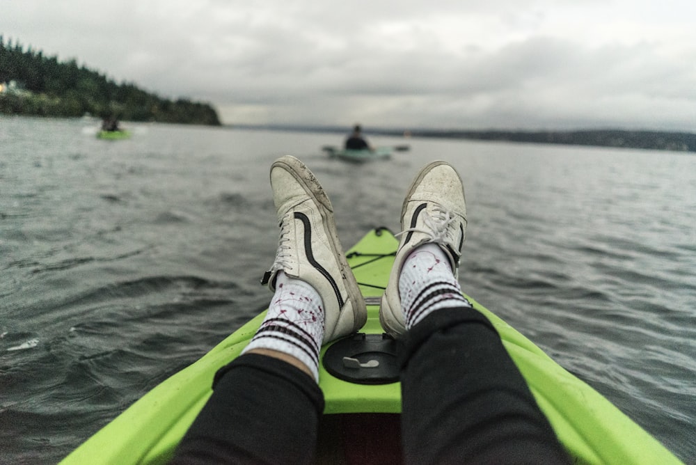 person on green boat