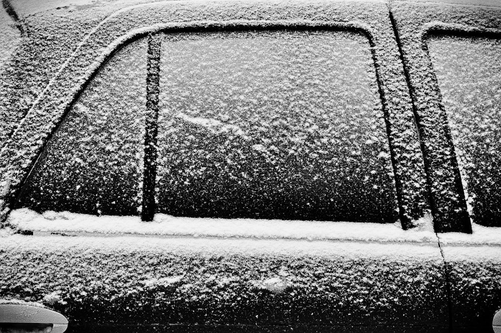 black car covered with snow