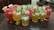 A vibrant display of assorted non-alcoholic beverages on a wooden table.