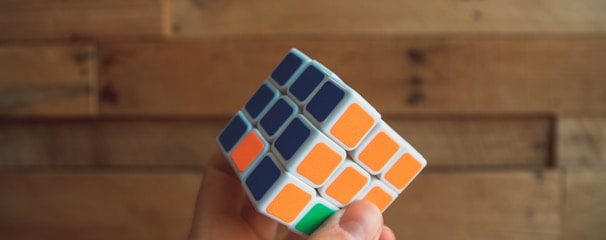 person holding 3x3 Rubik's Cube