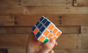person holding 3x3 Rubik's Cube