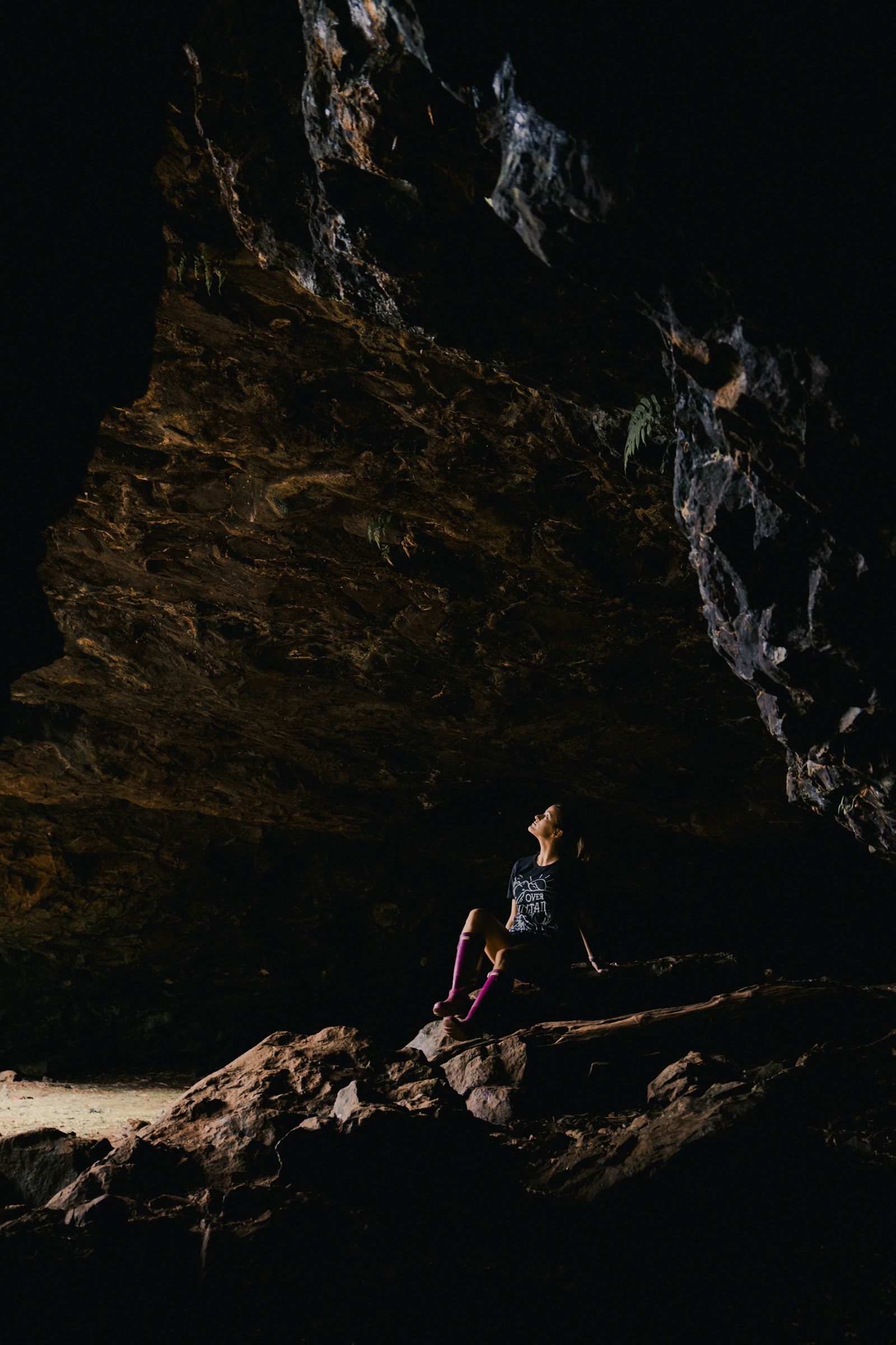 Sony Vario-Tessar T* E 16-70mm F4 ZA OSS sample photo. Woman sitting inside cave photography