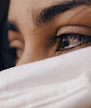shallow focus of a woman's sad eyes