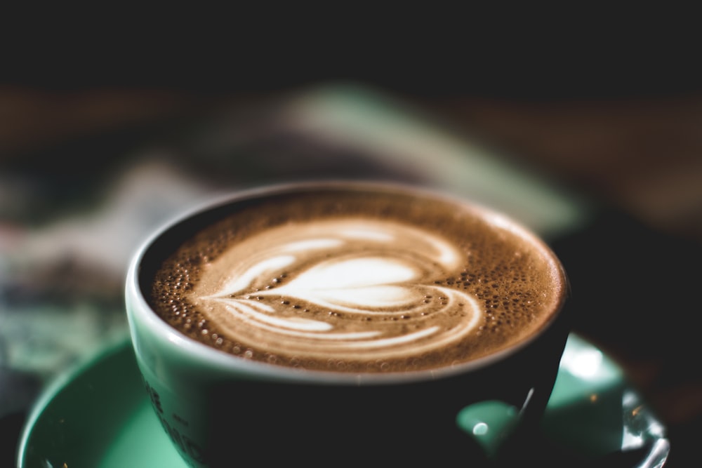 green ceramic mug filled with espresso