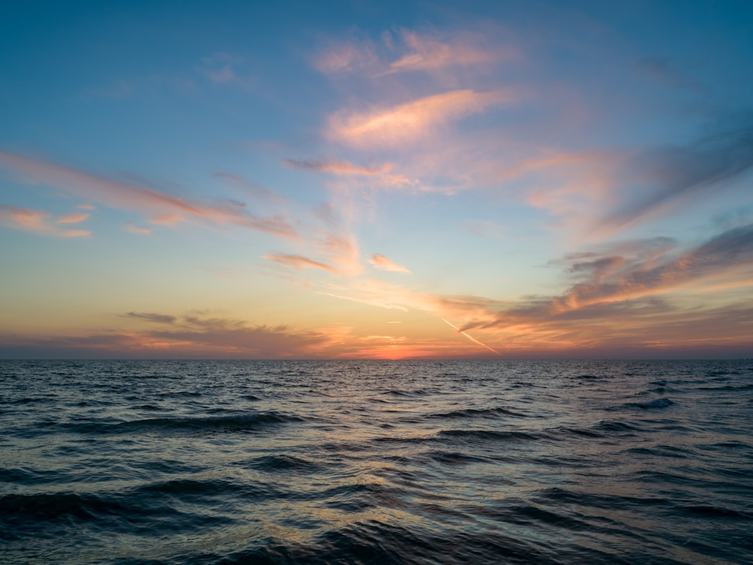 landscape photography of sea during golden hour,