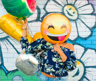 woman holding balloons