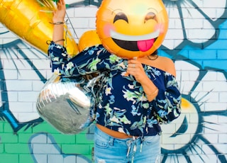 woman holding balloons