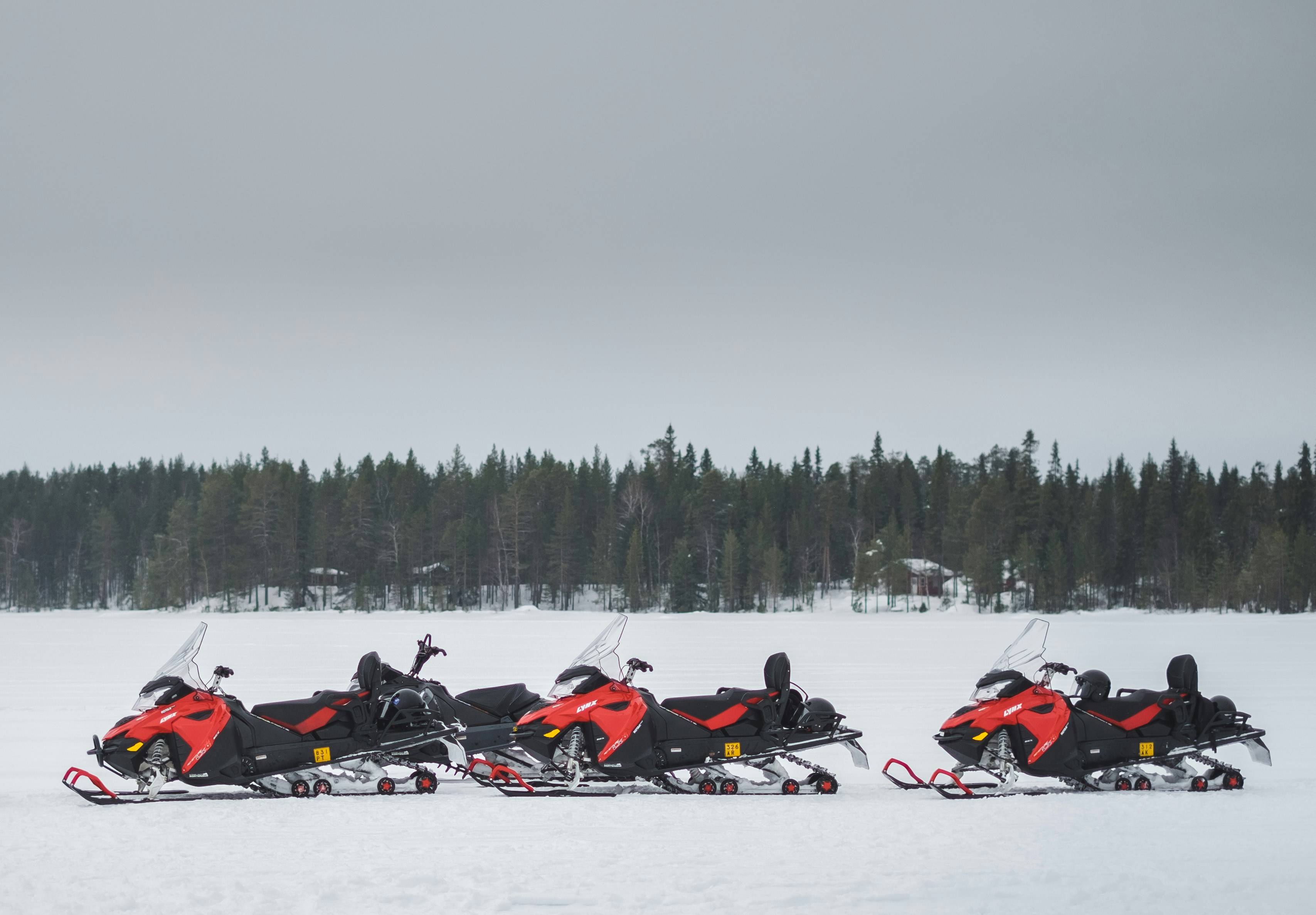 three snowblowers on snow covered field, Snow mobile in Lapland