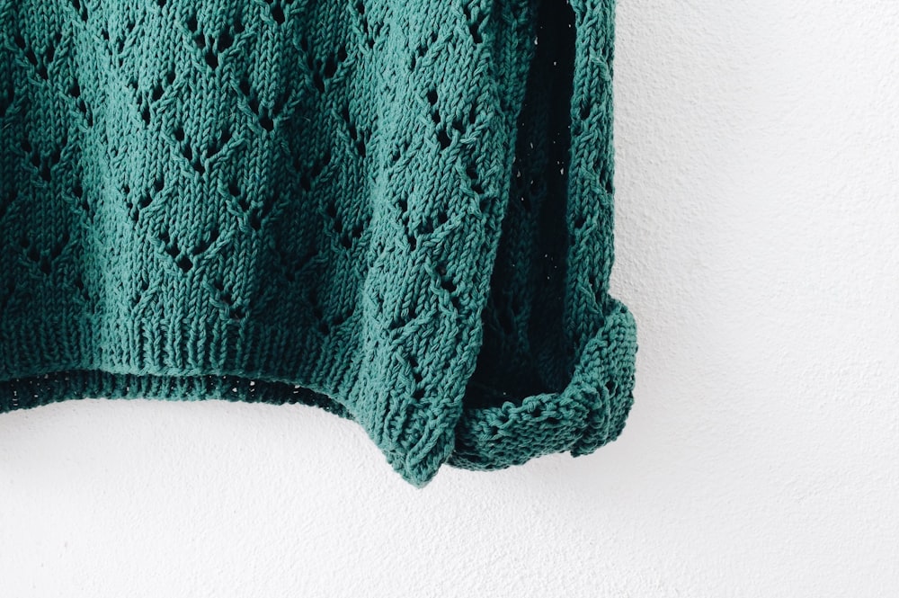 green knitted top