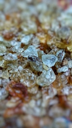 A close-up view of different crystals on a soft cloth, showcasing their unique textures.