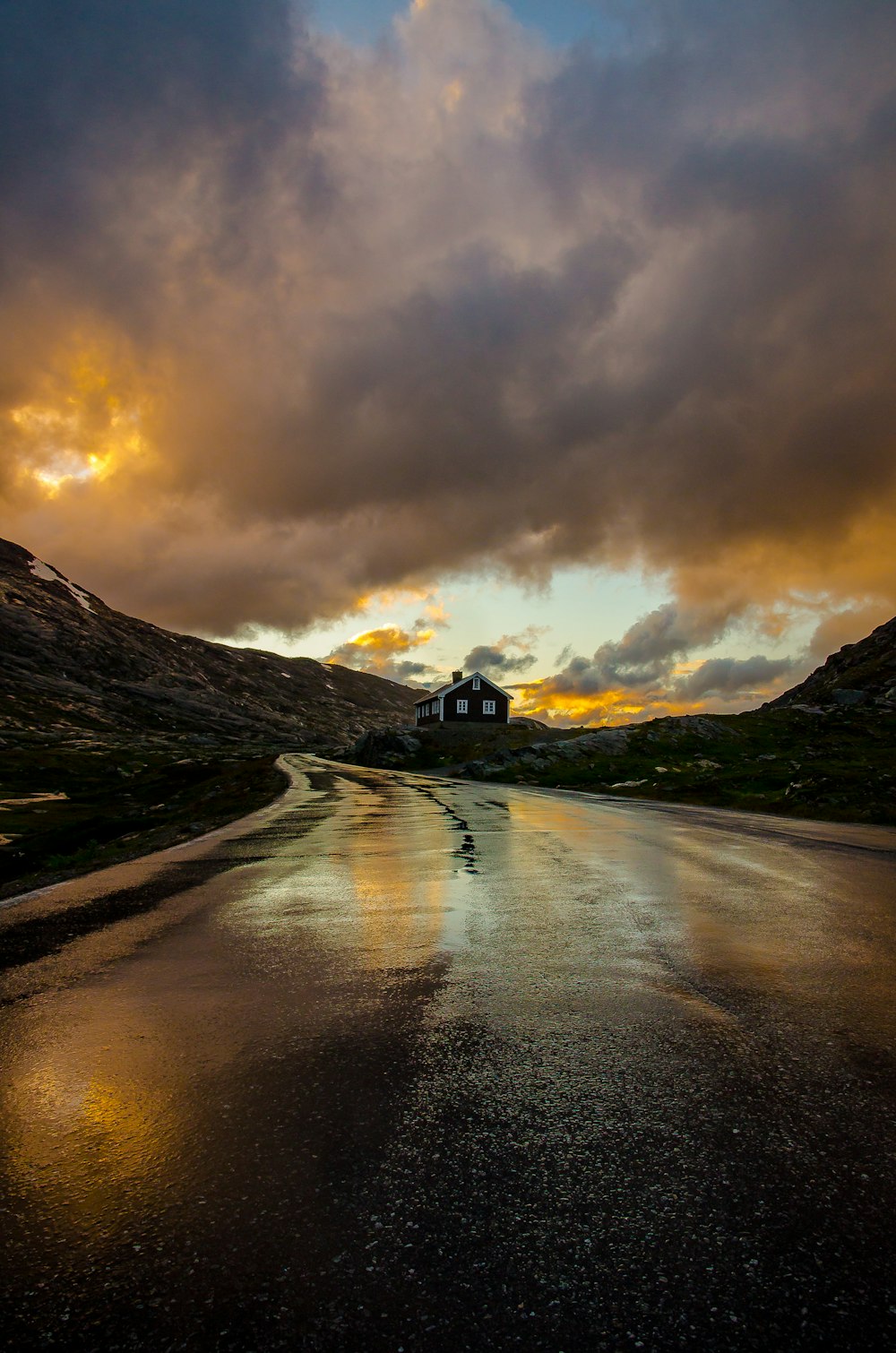 road leading to white and black house