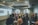 a group of people in a room with a projector screen