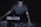 man in gray shirt using sound equalizer