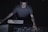 man in gray shirt using sound equalizer