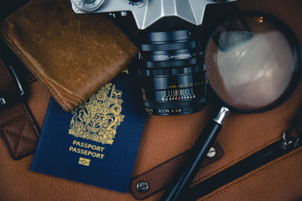 black magnifying glass and DSLR camera zoom lens