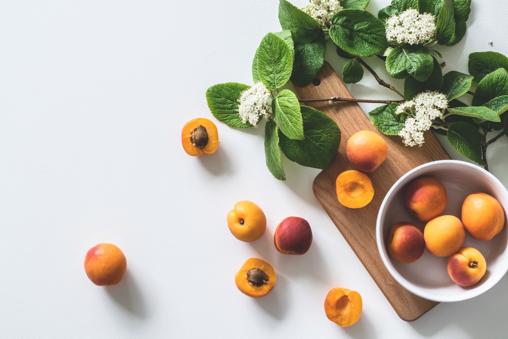 bunch of brown fruits near flowers