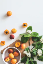 bunch of peach on white surface