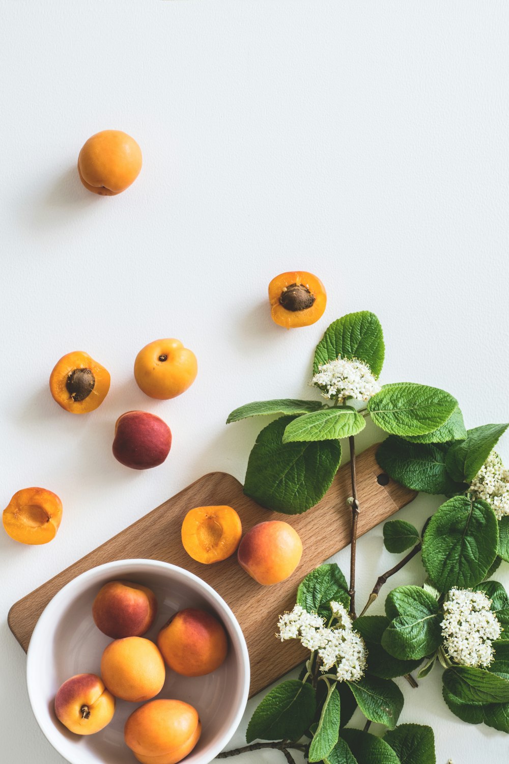 bunch of peach on white surface