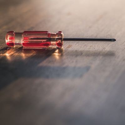 red and silver screw driver