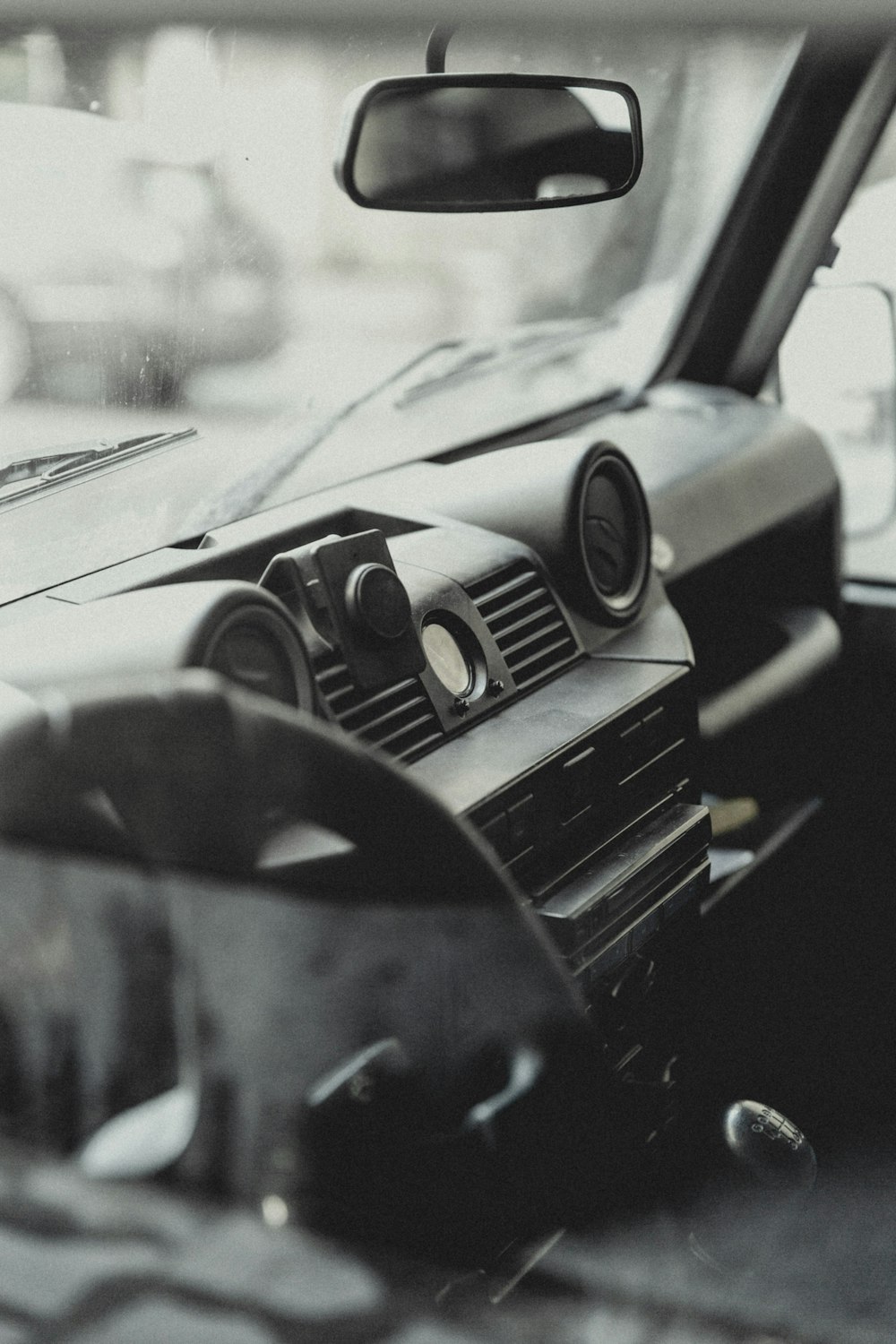 greyscale photo of vehicle dashboard console